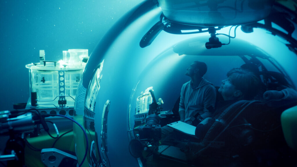 People in a submarine photo still from A Life Illuminated